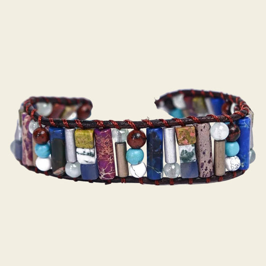 Handmade boho bracelet with colourful natural stone tube beads and accent beads, featuring an adjustable fit and earthy tones, perfect for casual and vibrant outfits.