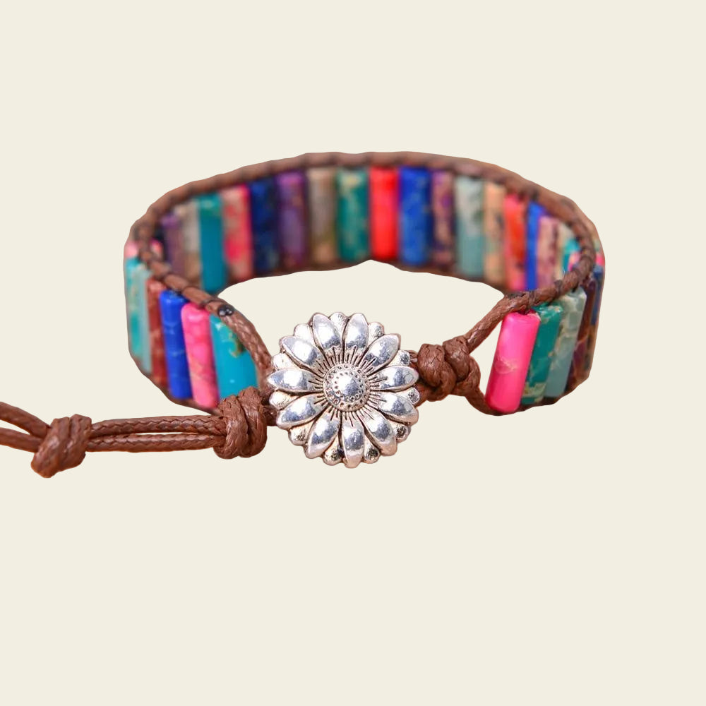 Handmade boho bracelet featuring colourful natural stone tubes with a silver flower clasp and adjustable fit, perfect for casual and festive occasions.