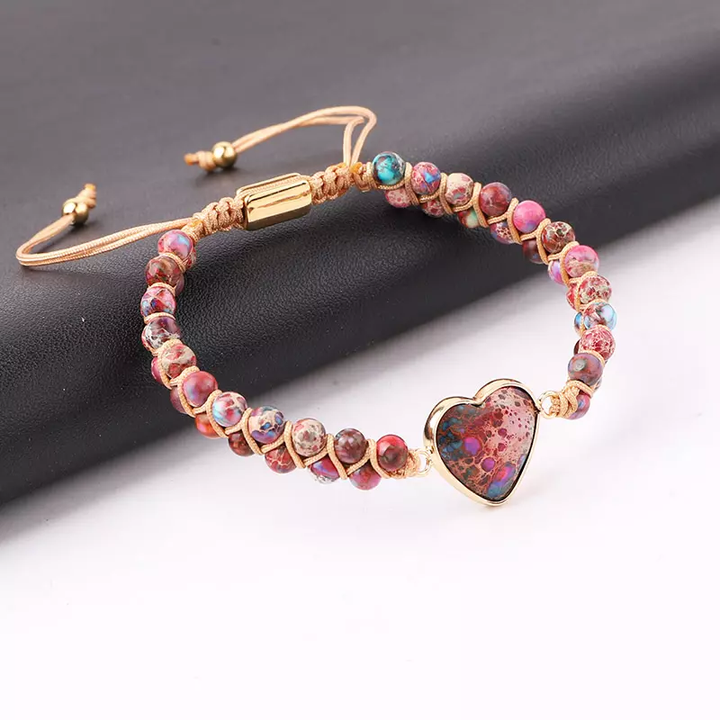 Handmade adjustable bracelet featuring Imperial Jasper beads with a heart-shaped stone centerpiece, accented with gold-tone details.