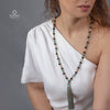 Handmade lava stone necklace with turquoise and gold accents, featuring a tassel, perfect for meditation and yoga practices.