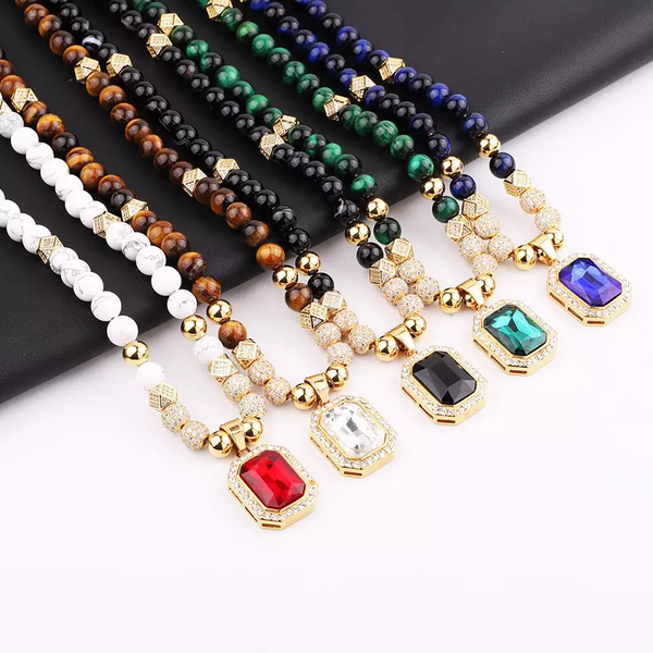 Luxurious handmade necklaces featuring vibrant natural stone beads in multiple colors, gold accents, and sparkling zircon-encrusted pendants, ideal for a glamorous jewelry collection.