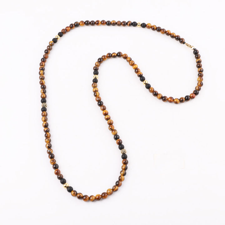 Handmade Tiger’s Eye and Onyx bead necklace with gold accents, combining natural stones for a sophisticated and versatile accessory, ideal for gifting.
