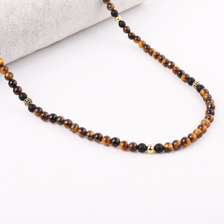 Handmade necklace featuring tiger’s eye and onyx beads with gold accents, designed for a natural stone gemstone look, perfect for everyday wear.
