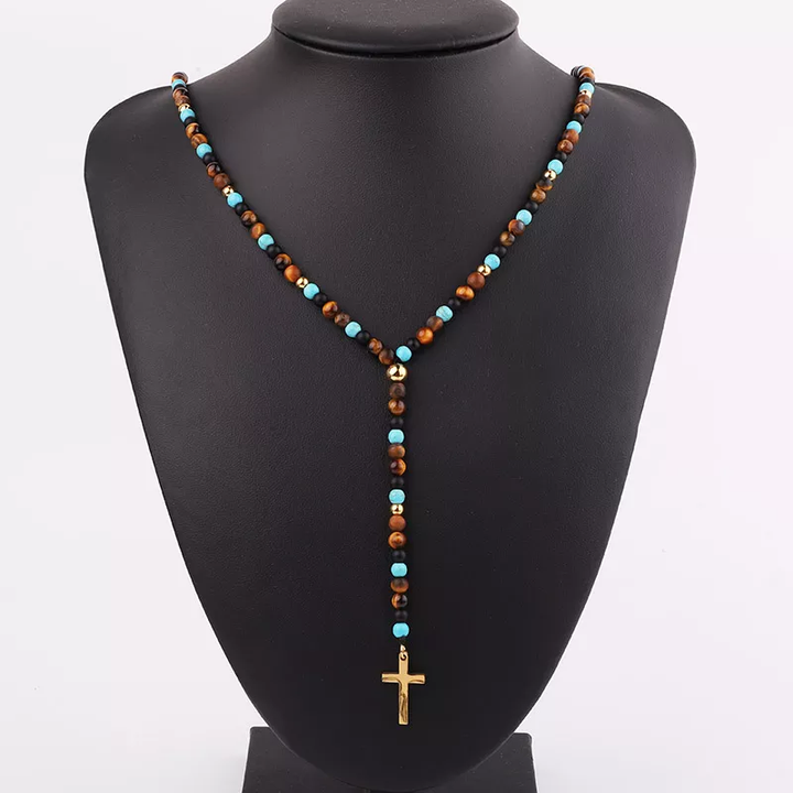 Handmade necklace featuring tiger’s eye and turquoise beads with gold accents and a gold cross pendant, ideal for casual and spiritual wear.