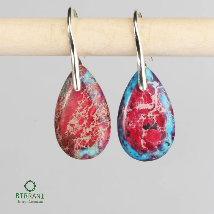 Vibrant drop earrings featuring stunning red and blue jasper stones, elegantly set in stainless steel, perfect for adding a bold touch to any outfit.