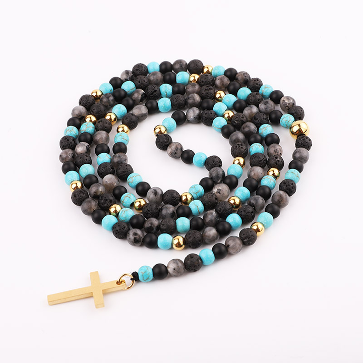 Handmade necklace with lava stone, turquoise beads, and gold accents, featuring a gold cross pendant.