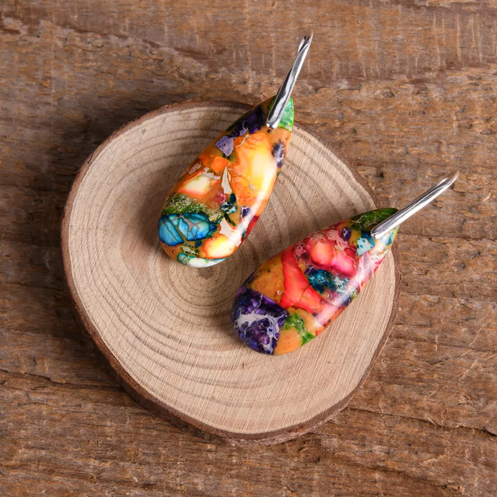 Multicolour drop earrings featuring a mix of natural stones in vibrant hues, set in stainless steel, designed for a bold and colourful statement.