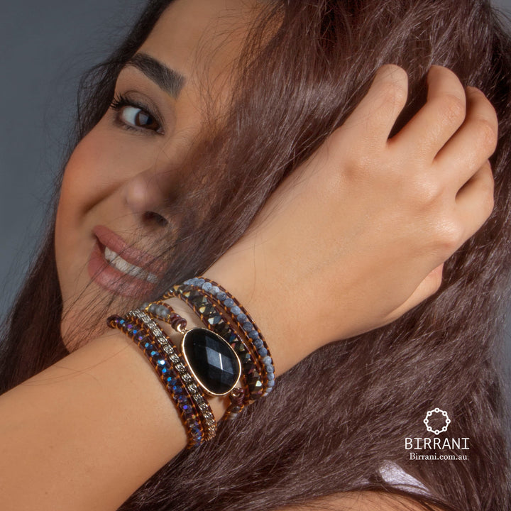 Handmade adjustable 5-wrap bracelet featuring onyx stone, crystals, and natural stones, perfect for adding a chic touch to any outfit.