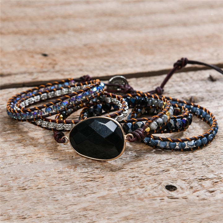 Handmade adjustable 5-wrap bracelet featuring black onyx and crystal beads with silver accents, perfect for stylish boho fashion.
