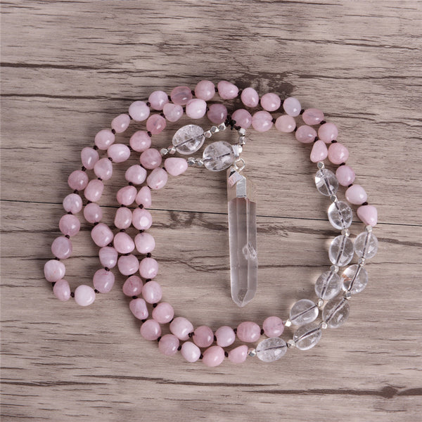 Handmade rose quartz crystal pendant necklace with clear crystal beads and silver accents, ideal for meditation and spiritual practices.