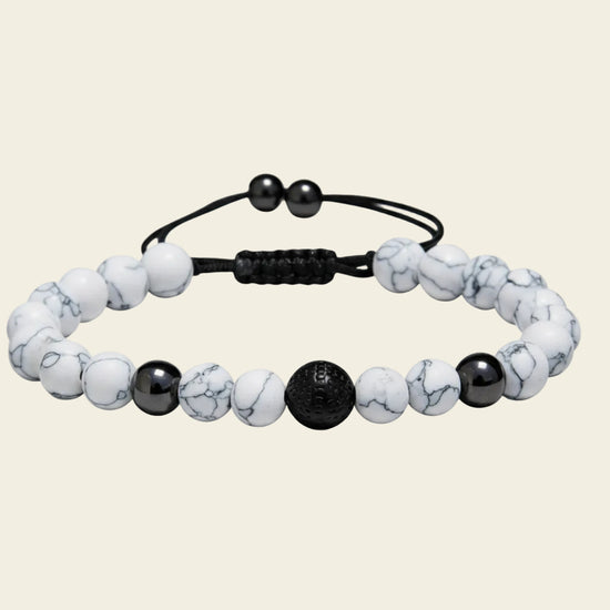 Handmade adjustable bracelet featuring white howlite beads with black accents, stylish boho jewellery for everyday wear or as a thoughtful gift.