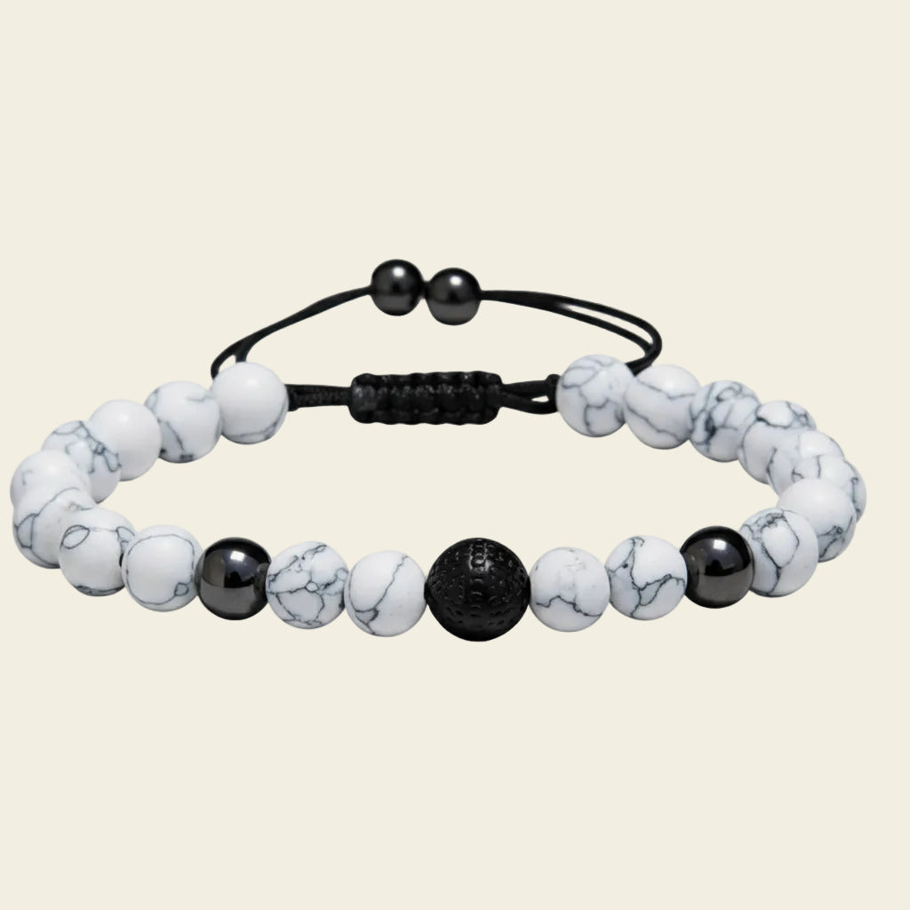 Handmade adjustable bracelet featuring white howlite beads with black accents, stylish boho jewellery for everyday wear or as a thoughtful gift.
